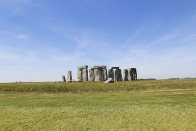 Built structure on field against sky