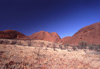 Scenic view of mountains against clear blue sky