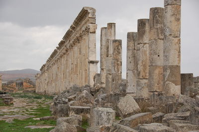 Old ruins of building against cloudy sky