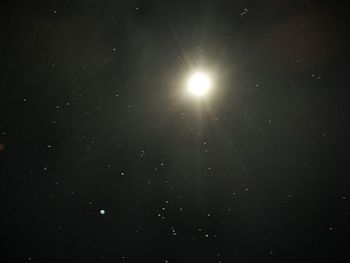 Low angle view of moon against sky at night