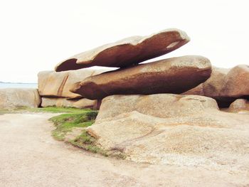 Close-up of stone stack on sand