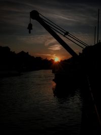 Scenic view of river against sky during sunset