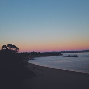 Scenic view of calm sea at sunset