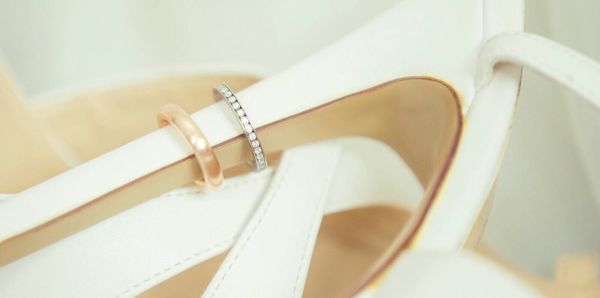 Close-up of wedding rings on stilettos