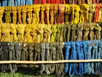 Full frame shot of colored yarn for sale at market stall