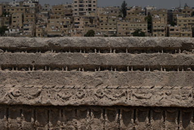 View of buildings on field in city