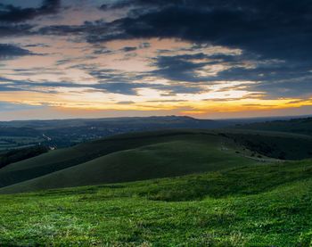 Scenic view of landscape against sky during sunset