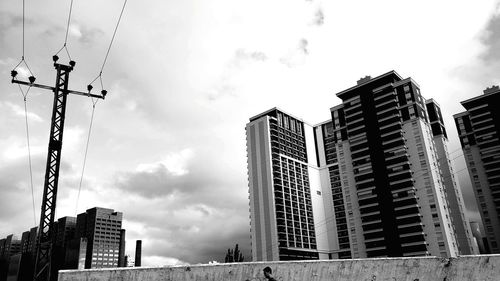 Low angle view of buildings against sky in city