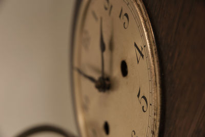 Close-up of clock on wall