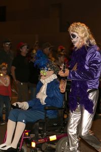 Rear view of people dancing at night