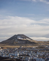 Aerial view of city against sky during winter