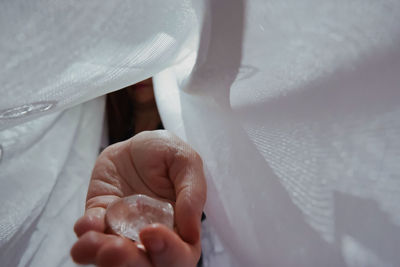 Close-up of man holding hands