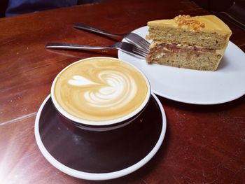 High angle view of coffee served on table