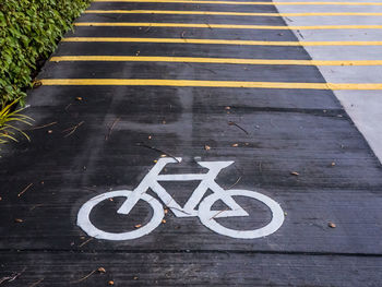 High angle view of bicycle sign on road