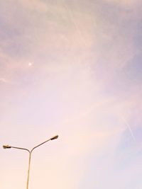 Low angle view of windmill against sky during sunset