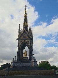 Low angle view of statue against sky in city