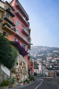 Street amidst buildings against sky