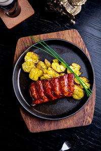 High angle view of meat on barbecue grill