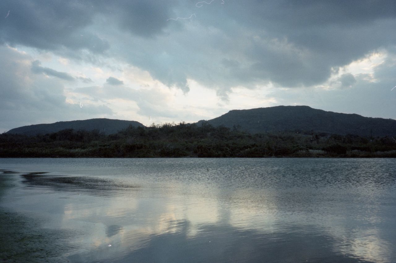 reflection, mountain, lake, water, sky, cloud, scenics - nature, body of water, nature, beauty in nature, morning, environment, reservoir, mountain range, tranquility, no people, landscape, tranquil scene, dusk, horizon, land, sunlight, outdoors, travel destinations, day, highland, shore, tree, non-urban scene, travel