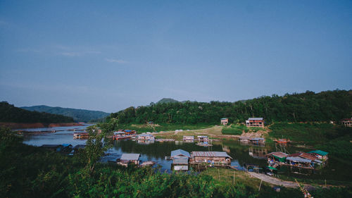 High angle view of buildings and trees against sky