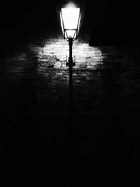 Illuminated street light at night