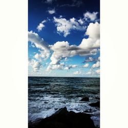 Scenic view of sea against cloudy sky