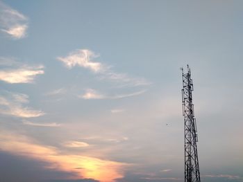 Low angle view of communications tower against sky