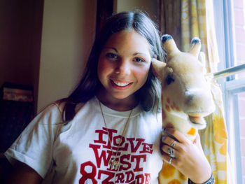 Portrait of smiling girl with horse