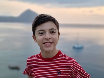 Portrait of smiling boy in lake