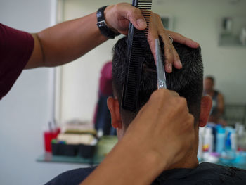 Hairdresser hairstyling male customer