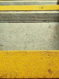 Close-up of yellow line on road