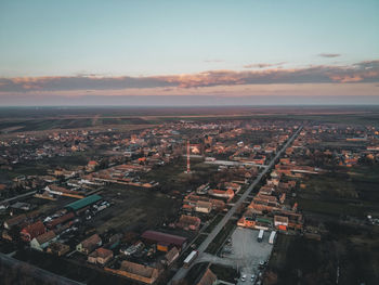 High angle view of buildings against sky at sunset