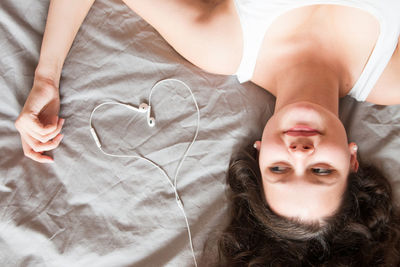 Portrait of young woman lying down