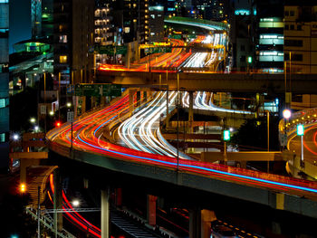 High angle view of light trails on road at night