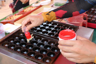 Close-up of man preparing food