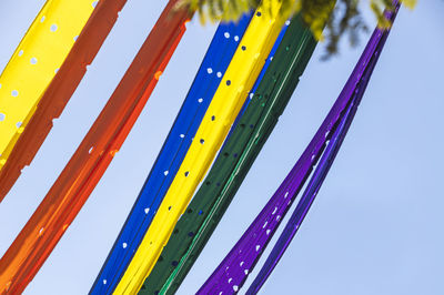 Low angle view of ferris wheel against blue sky