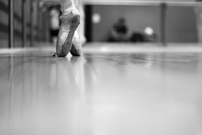 Low section of ballerina on tiptoe in dance studio