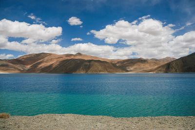 Scenic view of landscape and mountains against sky