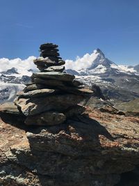 Stack of stone on mountain against sky