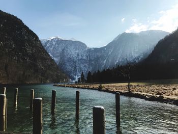 Scenic view of lake and mountains against sky