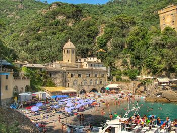 Group of people by buildings at beach