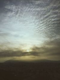 Scenic view of landscape against cloudy sky