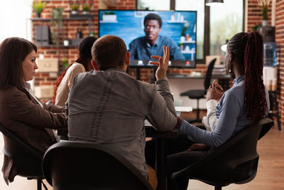 Business people talking on video conference in office