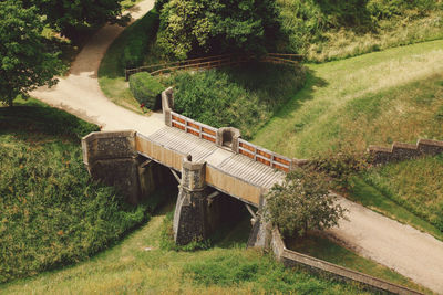 High angle view of footbridge over grassy field at arundel castle