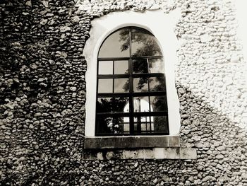 Low angle view of window on building wall