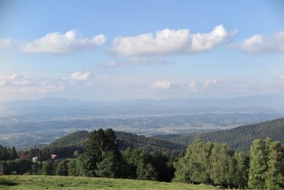 A scenic view of hills and villages from the mountain plateau