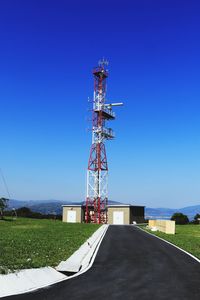 Communications tower against clear blue sky