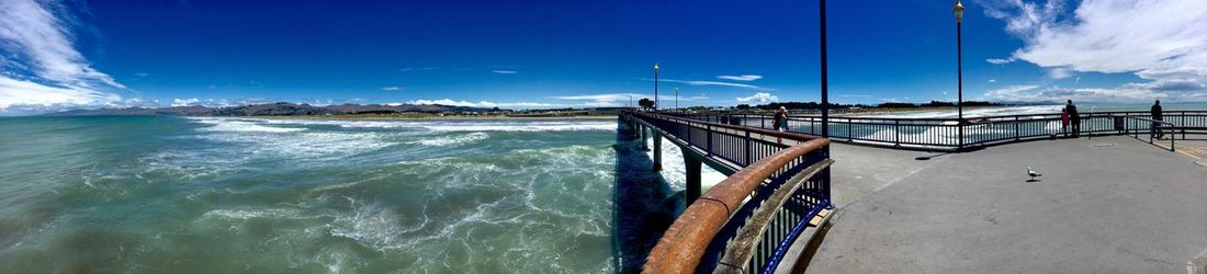 Scenic view of sea against blue sky