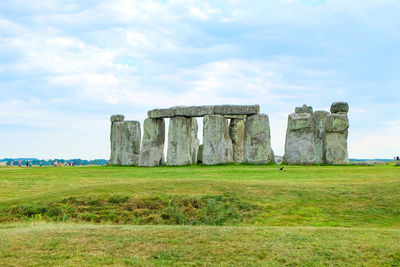 Built structure on field against sky