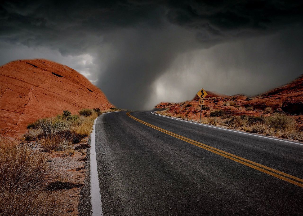 PANORAMIC VIEW OF ROAD ON MOUNTAIN AGAINST SKY